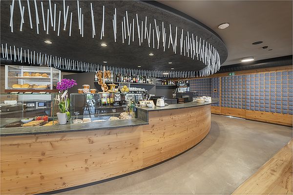 The bistro and bar counter with coffee machine and display case