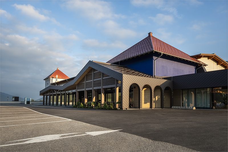 The building with the Dolomites behind