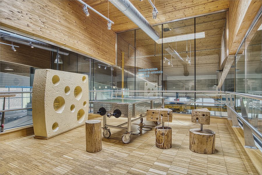 A large cheese with holes to climb through in the exhibition room